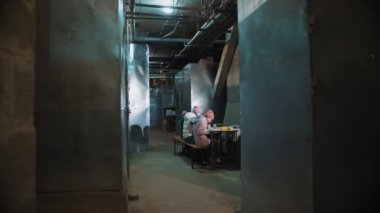 War in Ukraine. Bomb shelter. Children are hiding in shelter in the basement, during an air alert, rocket fire. They are drawing. Russian invasion. Stop war. No War.