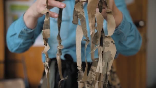 Military Camouflage Net Sewing Volunteer Demonstrates Self Made Khaki Tissue — ストック動画