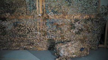 camouflage net . military. netting. protective camouflage nets of green or khaki fabric shreds, for the military needs of the army. volunteering