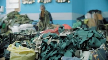 camouflage net . military. netting. protective camouflage nets of green or khaki fabric shreds, for the military needs of the army. volunteering