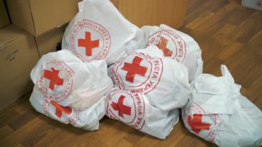 Red Cross Charity organization. Volunteer Warehouse. humanitarian aid to support and help Ukrainian refugees and migrants, during war, Russian invasion