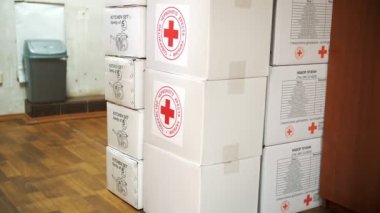 Red Cross Charity organization. Volunteer Warehouse. humanitarian aid to support and help Ukrainian refugees and migrants, during war, Russian invasion