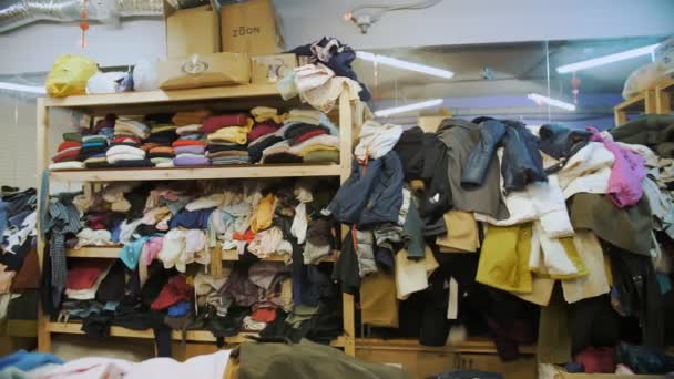 Warehouse Community Volunteer Center Shelves Donated Things Clothes Refugees Migrants — Video