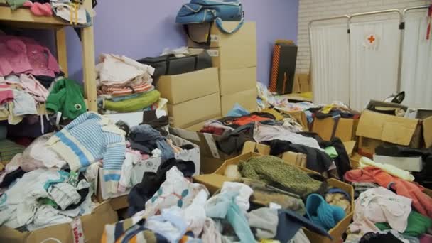Warehouse Community Volunteer Center Shelves Donated Things Clothes Refugees Migrants — Stock Video