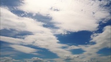 time-lapse. clouds. Cumulus clouds. cloudscape. Puffy fluffy white clouds are running against the blue sky. White clouds background. video loop.