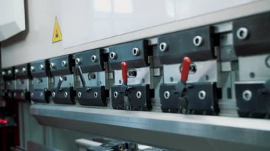 jig punch press. cnc control metal sheet bending hydraulic machine at the factory. close-up. metalworking machine.