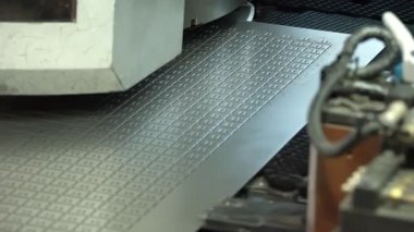 metal cutting. metalworking. close-up. Perforated metal panel. cutting machine for metal sheets in workshop