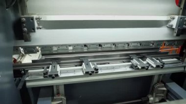 jig punch press. close-up. metal sheet bending machine. hydraulic press brake for flat sheet metal. Metal working. Industrial manufacturing.