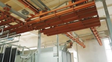 paint workshop. Industrial painting. painting in production workshop. at the factory. Painting top coat of steel structures or metal products at industrial factory