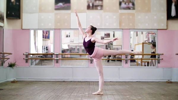 Dancing Hall Young Ballerina Black Leotard Performs Arabesque Raises Her — Zdjęcie stockowe