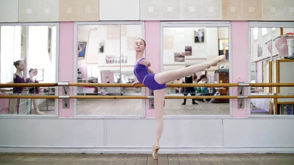 Dancing Hall Young Ballerina Purple Leotard Performs Developpe Attitude Pointe — Zdjęcie stockowe