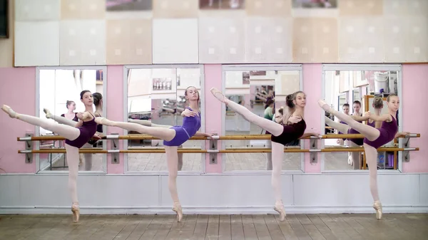 Dancing Hall Young Ballerinas Purple Leotards Perform Attitude Efface Pointe — Fotografia de Stock