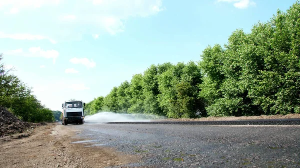 Repair Highway Road Construction Works Special Watering Machine Sprinkles Water — Stok fotoğraf