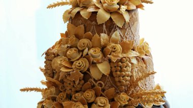 close-up, wedding loaf, cake, bread, decorated with various colors of dough, roses, dough leaves. wedding traditions, decor. High quality photo