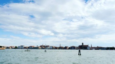 VENICE, ITALY - JULY 7, 2018: view from the sea to the Venetian islands. blue sea, sky, summer day. Burano, Murano, San Michele, San Giorgio Maggiore, San Servolo Island, St. George, Torcello. High