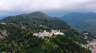BIELLA, ITALY - JULY 7, 2018: aero View of beautiful Shrine, ancient temple complex, big castle, sanctuary located in mountains near the city of Biella, Piedmont, Italy. summer. High quality photo