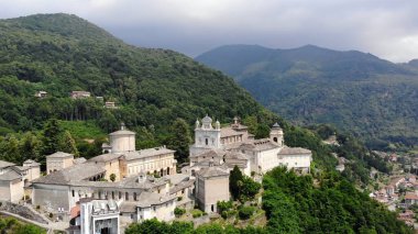 BIELLA, ITALY - JULY 7, 2018: aero View of beautiful Shrine, ancient temple complex, big castle, sanctuary located in mountains near the city of Biella, Piedmont, Italy. summer. High quality photo