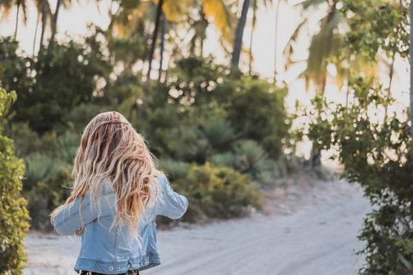 Blonde Woman Standing Backwards Jeans Jacket Magic Tropic Road — Stock Photo, Image
