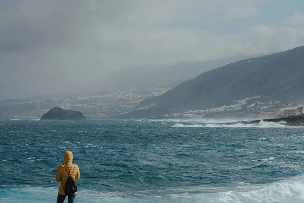 Woman Yellow Jacket Looking Fierce Ocean Waiting Storm — Stock Photo, Image
