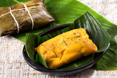Tamale Typical Colombian Food Wrapped In Banana Leaves clipart