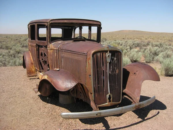 Rusty Old Car in the Desert Vintage Style. High quality photo