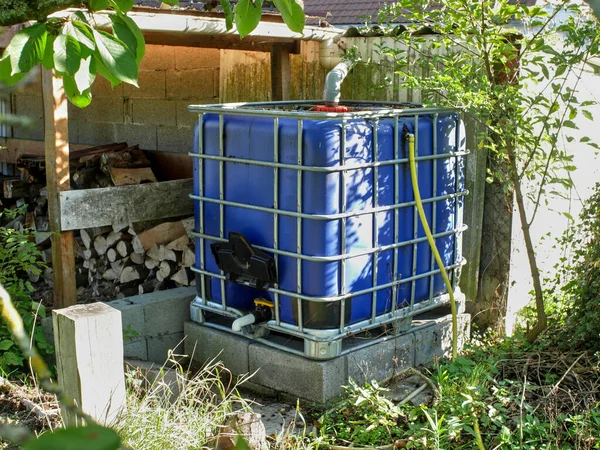 Rainwater Collection Tank Blue Walls Green Setting — Stock Photo, Image