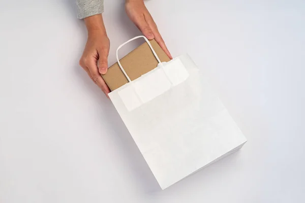 Hands Taking Box Out White Paper Bag White Background — Stock Photo, Image