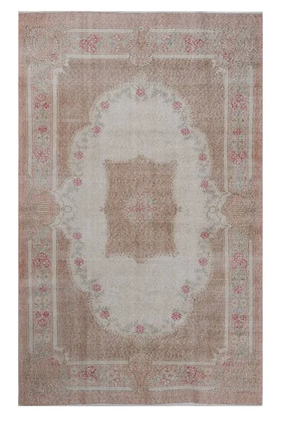 classic patterned machine rug on a white background