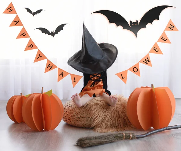 Happy halloween.  The little girl became a witch.  pumpkin, bat, witch hat and witch\'s broom