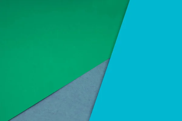 Dark and light, Plain and Textured Shades of sea green blue papers background lines intersecting to form a triangle shape