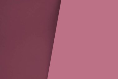 Karanlık, aydınlığa karşı soyut bir arkaplan. Doymuş şeftali pembesi renkleri iki parçaya ayrılmış.