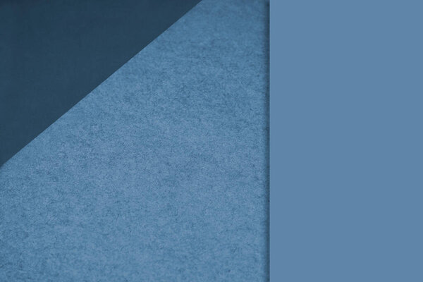 Textured and plain sheet papers forming two triangles and vertical blank rectangle for creative cover designing