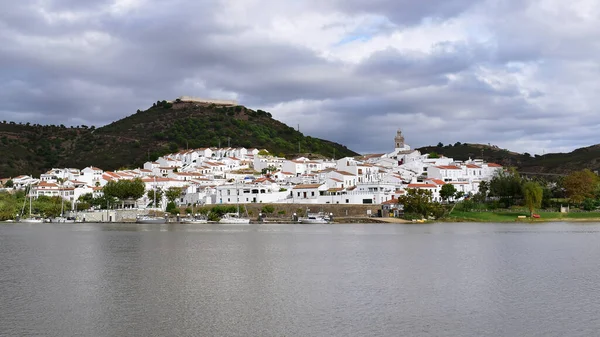 View Alcoutim (Portugal) over Guadiana river to Sanlucar de Guadiana (Spain), border town with white houses and medieval castle, Algarve, South Portugal, Europe