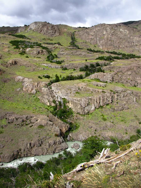 River running through green valley, Cerro Torre trail, El Chalten, Argentina, Patagonia