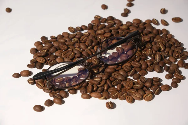 a lot of coffee beans on a white background