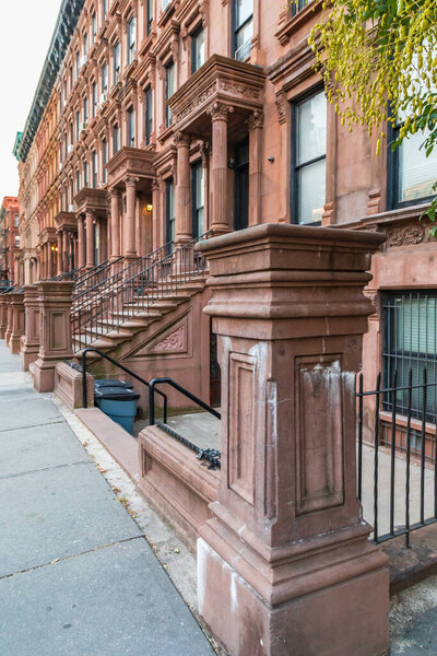 Harlem, Manhattan, New York City, New York, USA. Steps on brownstone houses in Harlem.