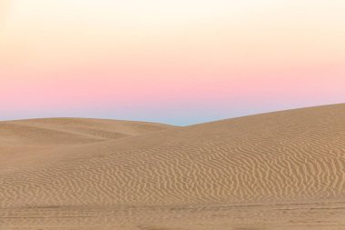 Guerro Negro, Mulege, Baja California Sur, Mexico. Sand dunes at sunset along the western coast of the Baja peninsula. clipart