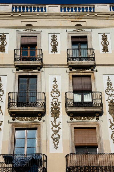 Tarragona, Spain. February 8, 2019. Old building facade and balconies