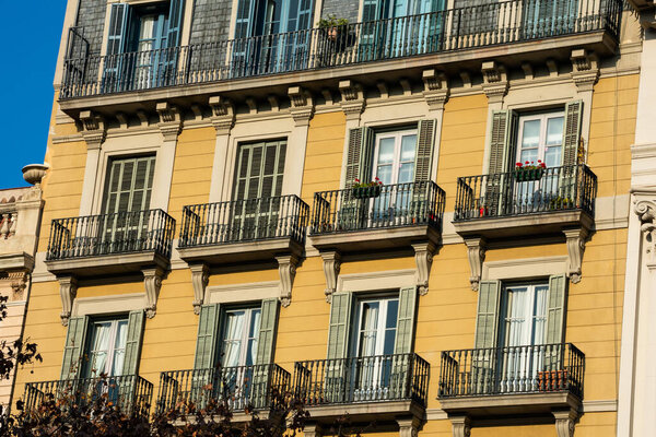 Barcelona, Spain. February 9, 2019. Old building facade and balconies on Passeig de Gracia Avenue (Paseo de Gracia)