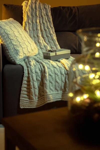 Christmas garlands on the couch in a cozy home environment. High quality photo