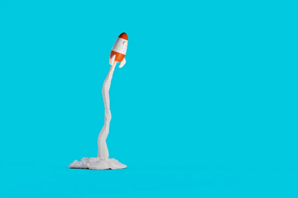3d cartoon rocket launch on blue background. 3D rendering.