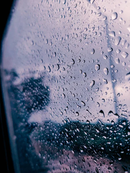 Focusing raindrops on car windows. Background of car window with water drops.