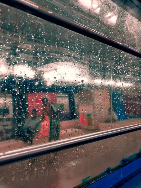 Drops of rain on the train window. Color tone texture background image.