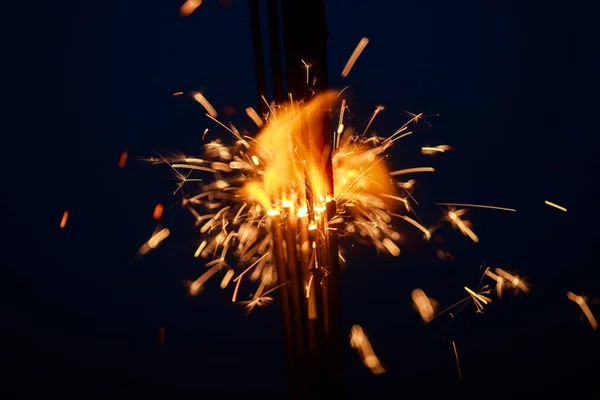 Sparklers close-up, special blur, focus on sparks.