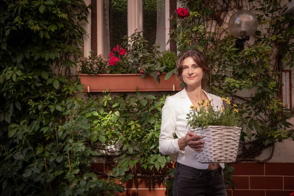 Happy Woman Holds Flowerpot Natural Flowers Lot Greenery Yard Rural — Fotografia de Stock