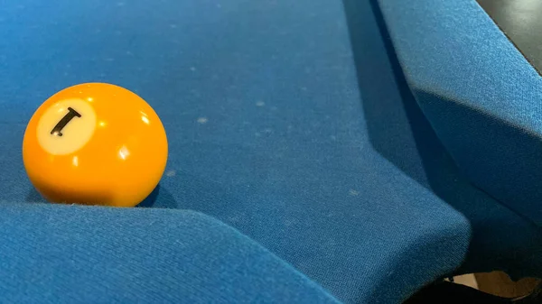 pool or billiards balls on light blue table