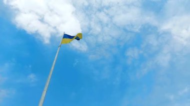 POLTAVA, UKRAINE - MAY 4, 2022: Flagpole with the flag of Ukraine