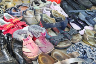 Worn-out shoes on the market for the underprivileged