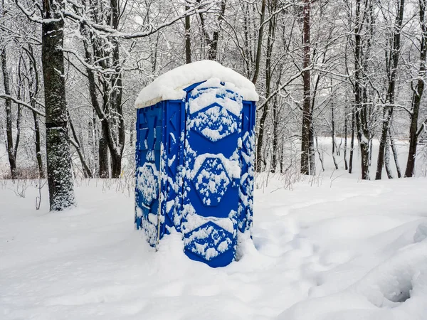 Toilet in the snow. Eco-friendly bio toilet in nature. Outdoor chemical toilet in the winter park.