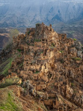 Sights of Dagestan. Abandoned ethnic aul. Old abandoned ghost town of Gamsutl, Dagestan, Russia. Vertical view. 